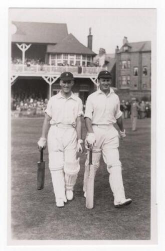 Scarborough Cricket Festival 1935. H.D.G. Leveson-Gower's XI v South Africans, 7th- 9th September 1935. Mono real photograph postcard of Eric Rowan and Bruce Mitchell walking out to bat for South Africa, the pavilion in the background. Stamp for Walkers S