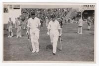 Scarborough Cricket Festival 1938. Gentlemen v Players, 7th- 9th September 1938. Mono real photograph postcard of Barnett and Fishlock walking out to bat for the Players. Stamp for Walkers Studio, Scarborough, to verso. VG - cricket