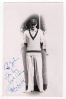 Hugh Joseph Tayfield. Natal, Rhodesia, Transvaal & South Africa 1945-1963. Mono real photograph postcard of Tayfield in cameo standing full length wearing cricket attire at Scarborough, probably on the 1951 tour to England. Nicely signed to the photograph