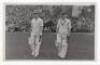 Scarborough Cricket Festival 1948. H.D.G. Leveson-Gower's XI v Australians, 8th- 10th September 1948. Mono real photograph postcard of Martin Donnelly and Laurie Fishlock walking out to bat for Leveson-Gower's XI. Stamp for Walkers Studio, Scarborough, to