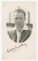 Charles William 'Charlie' Walker. South Australia 1928-1941. Mono real photograph postcard of Walker, head and shoulders in cameo, wearing tour blazer. Very nicely signed in black ink by Walker to front. Official stamp to verso for A. Wilkes & Son, West B