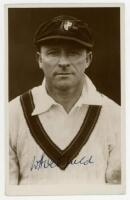 William Albert Stanley 'Bert' Oldfield, New South Wales & Australia 1919-1938. Sepia plain back postcard/ trade card of Oldfield, head and shoulders, in Australian sweater and cap on the 1930 tour of England. Very nicely signed in ink by Oldfield. Publish