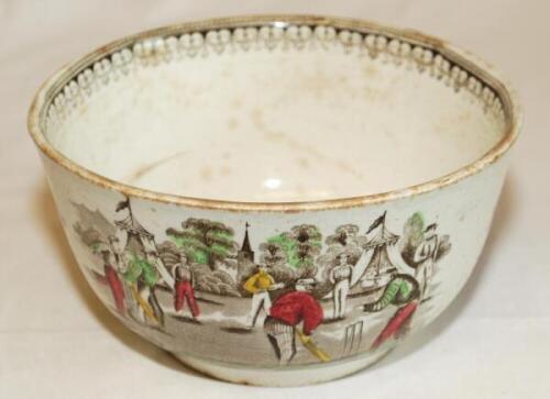 Village cricket bowl. Staffordshire 19th century bowl, transfer printed in sepia with three scenes of village cricket, with church and tents to background, to sides, floral and oak leaf inner rim decoration. Hand coloured in green, burgundy and yellow. Ap