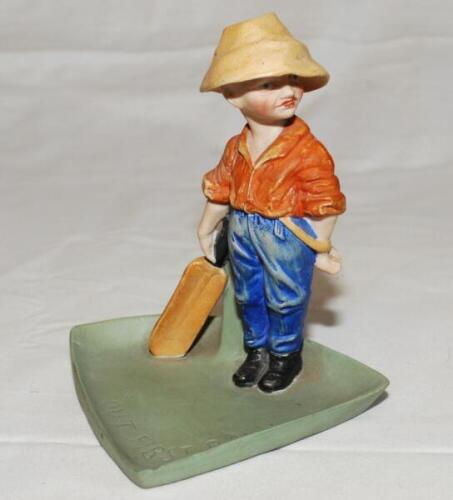 'Out First Ball'. Ceramic match holder c.1950s of a figure of a boy cricketer after Kinsella standing on a triangular base with inscribed title. Maker's mark to underside. 5.5" tall. G - cricket