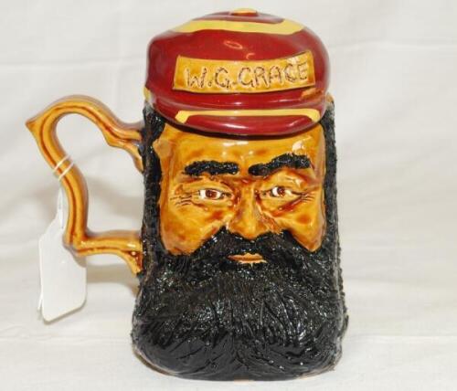 'W. G. Grace'. Ceramic caricature toby jug depicting Grace with separate lid formed as his striped cap with title to cap. The tankard stands 6.5" tall. Limited edition. Produced by The Hambledon Trading Company (John Brindley) c1980/90's. G - cricket