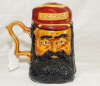 'W. G. Grace'. Ceramic caricature toby jug depicting Grace with separate lid formed as his striped cap with title to cap. The tankard stands 6.5" tall. Limited edition. Produced by The Hambledon Trading Company (John Brindley) c1980/90's. G - cricket