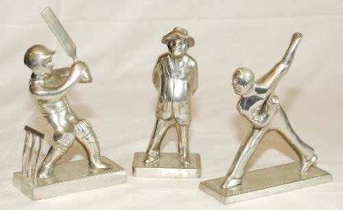 Silver metal cricketing figures. Three modern metal figures of a bowler, batsman and umpire by Dave [Cave] Shepherd. Each stamped 'Barbados' to base with his name and the price paid. Attractive figures, each approximately 5" tall. VG - cricket