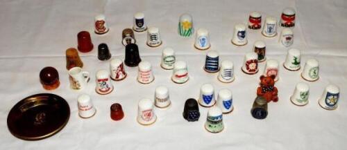 Cricket thimbles. A collection of fifty one mainly ceramic thimbles with the odd example in metal and wood, the majority depicting County cricket club emblems. Counties are Derbyshire, Durham, Essex, Glamorgan (Qty 2 different), Gloucestershire, Hampshire