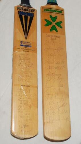England v South Africa 1998 and 2003. Full size Duncan Fearnley 'Cornhill Insurance Test Series 1998' bat signed to the face by twelve members of the England team and sixteen members of the South African touring party. Signatures include Stewart, Hussain,