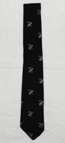 John Richard Reid. Otago, Wellington & New Zealand 1947-1965. Official New Zealand silk tie with silver ferns and 'NZCC XI' emblems on black background, issued to Reid for the 1965 tour to England. The tie by 'Eskay' of Wellington with Reid's name in ink 