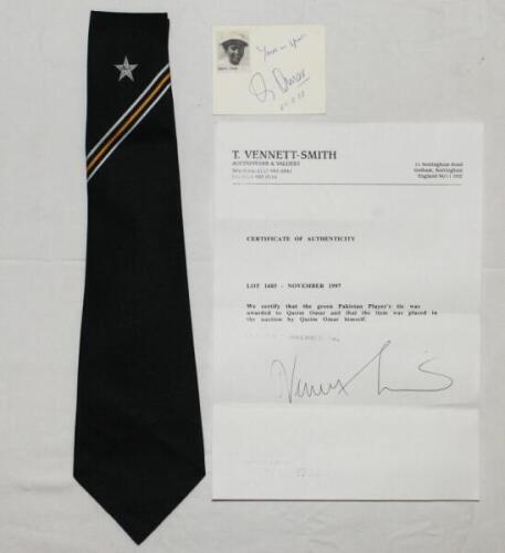 Qasim Omar [Umar]. Pakistan. Official Pakistan Test green tie with star emblem, white and gold stripes by 'Bill Edwards' of Swansea, issued to and worn by Omar in his playing career. The tie previously sold on Omar's behalf by T. Vennett-Smith in November
