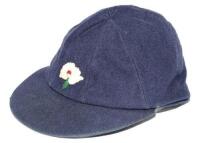 Donald Wilson. Yorkshire & England, 1957-1974. Yorkshire navy blue cloth 1st XI cricket cap worn by Wilson. The cap, by 'Herbert Sutcliffe of Leeds', embroidered with the White Rose of Yorkshire to cap. Name 'Don Wilson' handwritten to label. Some minor w