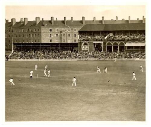 Len Hutton 364. England v Australia, fifth Test, The Oval, 20th- 24th August 1938. Large original mono press photograph of a general view of The Oval on the third day's play, with Maurice Leyland in batting action with Hutton at the non-striker's end in t