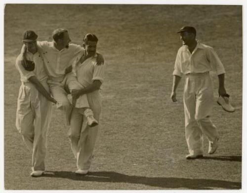 Don Bradman 1938. Original mono press photograph of Bradman being carried off the field at The Oval having injured his foot in the fifth Test. Date stamp to verso, 23rd August 1938. Central Press Photos, London. 9.5"x7.25". G/VG - cricket - cricket