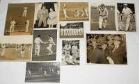Don Bradman 1930-1948. Nine original mono press photographs featuring Bradman in batting action, entering and leaving the field of play, the Australian team lined up in front of the pavilion at The Oval in 1938, and signing his autograph for a young girl.