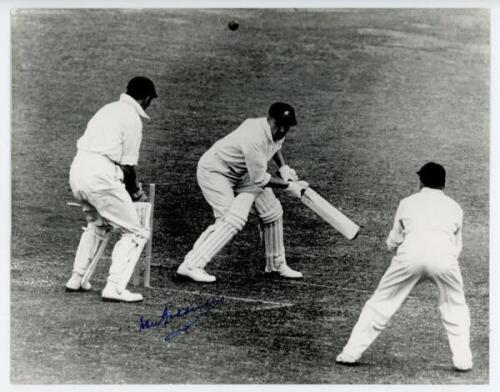 Don Bradman. Mono restrike press photograph of Bradman being dismissed, bowled, while batting for Australia. Signed to the photograph in blue ink by Bradman. Date and match unknown. 10"x8". Sport & General. VG - cricket