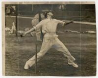 Don Bradman. Original mono press photograph, unusually depicting Bradman bowling in the nets at The Oval in 1938. The photograph, date stamped to verso 19th August 1938, by Central Press Photos, London, measures 9.5"x7.5". Press masking and vertical creas