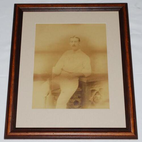 Willie Bates. Yorkshire & England 1877-1887. Original sepia studio portrait photograph of Bates seated three quarter length in cricket attire, his hand resting on a cricket bat. The photograph by E. Hawkins of Brighton, early 1880s, measures approx. 9.5"x