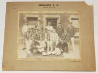 'Middlesex C.C. Champion County 1903'. Original official sepia photograph of the Middlesex team seated and standing in rows wearing cricket attire and assorted caps and blazers at The Oval, probably for the Champion County match v The Rest, 14th- 16th Sep