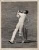 Frank Woolley. Kent & England 1906-1938. Excellent original mono press photograph of Woolley playing a lofted attacking shot to leg. The photograph partly laid to mount with handwritten caption in ink to verso, 'Frank Woolley hits Alf Gover out of the Ova