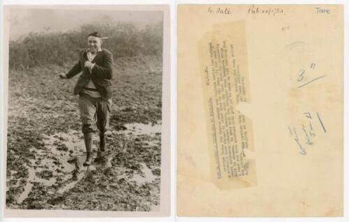 Maurice William Tate. Sussex & England 1912-1937. An unusual original mono press photograph of Tate depicted full length on a winter training run in a very muddy field wearing plus fours, cricket sweater and jacket, with a broad grin on his face, 1931. Ph
