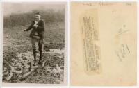 Maurice William Tate. Sussex & England 1912-1937. An unusual original mono press photograph of Tate depicted full length on a winter training run in a very muddy field wearing plus fours, cricket sweater and jacket, with a broad grin on his face, 1931. Ph