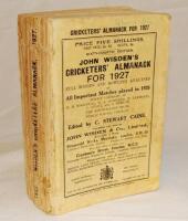 Wisden Cricketers' Almanack 1927. 64th edition. Original paper wrappers. Vertical crease to front wrapper, some breaking to spine block, some loss to spine paper, minor ink staining to rear wrapper, name handwritten to top border of the front wrapper othe