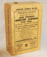 Wisden Cricketers' Almanack 1934. 71st edition. Original paper wrappers. Broken spine block, contents becoming a little loose. Some soiling and wear to wrappers, some corner wear with loss to wrappers, nicks to wrapper edges otherwise in good condition - 