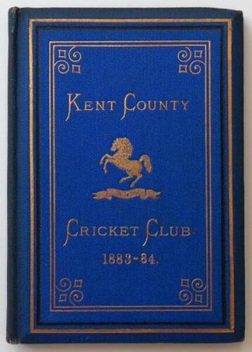 Kent County Cricket Club Annual 1883-1884. Hardback 'blue book'. Original decorative boards. Gilt titles and to all page edges with gilt Kent emblem to centre. Printed by Cross & Jackman, 'The Canterbury Press' 1884. Minor age toning/darkening to board ed