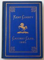 Kent County Cricket Club Annual 1895. Hardback 'blue book'. Original decorative boards. Gilt titles and to all page edges with gilt Kent emblem to centre. Printed by Cross & Jackman, 'The Canterbury Press' 1895. Minor age toning/darkening to board edges a
