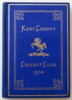 Kent County Cricket Club Annual 1904. Hardback 'blue book'. Original decorative boards. Gilt titles and to all page edges with gilt Kent emblem to centre. Printed by the Kentish Express (Igglesdon & Co) of Ashford 1904. Minor age toning/darkening to board