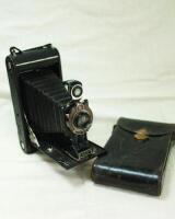 Photographic equipment. Eastman Kodak. c.1920 'No. 3A Autographic Kodak Junior' folding bed camera with Rapid Rectilinear lens by Bausch & Lomb and Kodak ball bearing shutter. Appears to feature three serial numbers, 12428 to shutter/ lens, 13460 to front