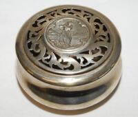 Silver pot pourri holder. Circular decorative holder with perforated top and figure of a lady golfer. Sterling silver with hallmark to base for London 1903, makers mark 'W.C.' William Comyns & Sons. 3" diameter, 1.75" tall. VG