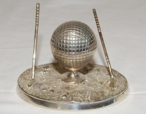 Golf ink stand. Attractive silver plated ink stand in the form of a hinged golf ball on tee with metal liner, two upright golf clubs to either side. James Dixon of Sheffield c.1930. 3" tall. G