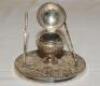 Golf ink stand. Attractive silver plated ink stand in the form of a hinged golf ball on tee with metal liner, two upright golf clubs to either side. James Dixon of Sheffield c.1930. 3" tall. G - 2