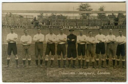 Tottenham Hotspur tour of Germany 1911. Early sepia real photograph postcard of the team standing on the pitch in front of a goal prior to the match against Wacker Leipzig on the German tour, with title printed to lower border, to the right 'Tottenham-Hot