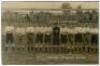 Tottenham Hotspur tour of Germany 1911. Early sepia real photograph postcard of the team standing on the pitch in front of a goal prior to the match against Wacker Leipzig on the German tour, with title printed to lower border, to the right 'Tottenham-Hot