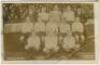 'Tottenham Hotspur Cup Team 1910'. Early mono real photograph postcard of the team and officials, standing and seated in rows on the pitch with the large crowd behind them, for the matches played at White Hart Lane, with printed title 'Tottenham Hotspur C