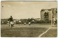 Tottenham Hotspur tour of Germany 1911. Early sepia real photograph postcard showing a match in progress on the German tour with the football high in the air. Publisher unknown. Postally unused. Annotation to postcard verso in German. Sold with a letter f