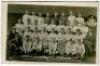 Tottenham Hotspur F.C. 1919/20. Mono real photograph postcard of the playing staff and officials standing and seated in rows plus inset cameo of three players, with title printed to lower border 'Tottenham Hotspur. League Champions II Division, Winners, N