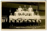 Tottenham Hotspur F.C. 1919/20. Early mono real photograph postcard of the team, the Manager, Peter McWilliam and the Chairman standing and seated in rows in front of the Main Stand, with title printed to lower border. Appears to be by Crawford of Edmonto