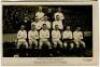 'Tottenham Hotspur Cup Team 1921'. Early mono real photograph postcard of the team and trainer, Minter, standing and seated in rows on the pitch with the large crowd behind them, with printed title 'Tottenham Hotspur Cup Team 1921' and players names print