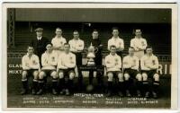 Tottenham Hotspur F.C. 1921/22. Mono real photograph postcard of the team and trainer, standing and seated in rows, with the English Cup on display to centre, with title printed to lower border 'Hotspur Team 1921-22'. Publisher unknown. Postally unused. G