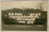 Tottenham Hotspur F.C. 1926/27. Mono real photograph postcard of the playing staff, officials and directors, standing and seated in rows, with title to lower border. W.J. Crawford of Edmonton. Postally unused. Some soiling and wear to postcard, creasing t