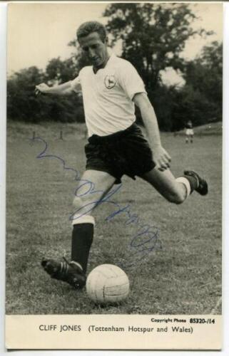 Clifford William Jones. Tottenham Hotspur 1958-1968. Mono plain backed real photograph postcard of Jones, full length in Spurs attire, about to kick the ball. Signed by Jones to image. Printed title to lower border. Good condition - football