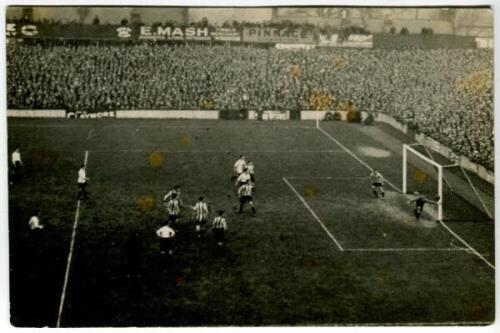 Tottenham Hotspur F.C. 1920's. Action real photograph postcard from the match with very large crowd in attendance. Publisher unknown. The image slightly out of focus. Good/very good condition. A rare postcard - football