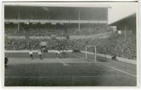Tottenham Hotspur F.C. Action real photograph postcard from a pre war match at White Hart Lane with very large crowd in attendance. Publisher unknown. The image slightly out of focus. Good/very good condition. A rare postcard - football