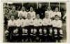Tottenham Hotspur F.C. 1933/34. Mono postcard size real photograph of the team, standing and seated in rows. Albert Wilkes & Son, West Bromwich. Very good condition - football