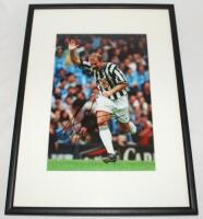 Alan Shearer. Newcastle United. Excellent colour photograph of Shearer having just scored for Newcastle United, with his trademark celebration of one arm in the air. Signed to the photograph by Shearer. Mounted, framed and glazed, overall 12.5"x17". VG - 