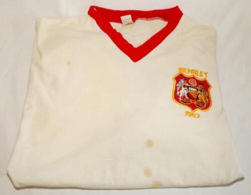 Aston Villa v Manchester United. F.A. Cup Final 1957. White with red trim v-necked replica shirt. The shirt with United emblem and the wording 'Wembley' and '1957' above and below the emblem. The shirt appears to be a 1960/70's replica. The shirt was fram